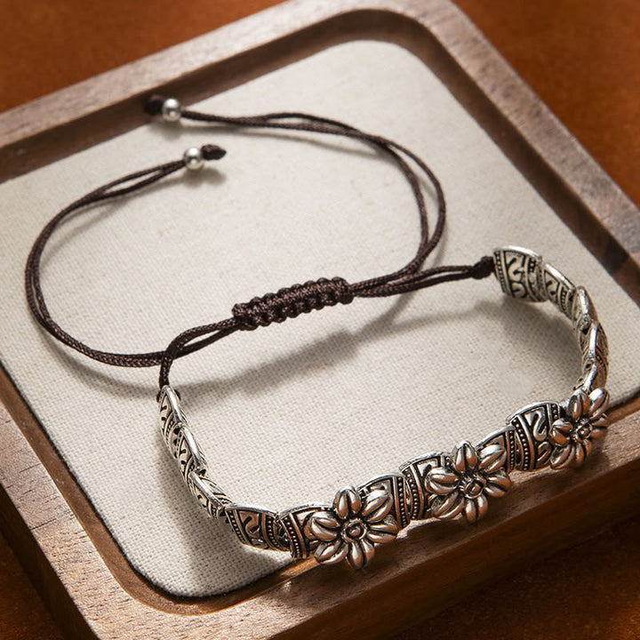 LAVINIA | CARVED DAISY BEAD CORD BRACELET